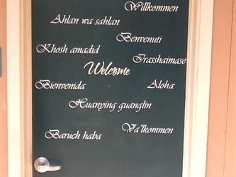 door with welcome printed in many languages
