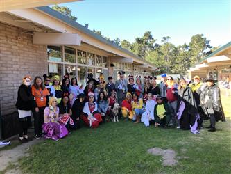 Staff wearing Disney-themed costumes from Halloween 2019